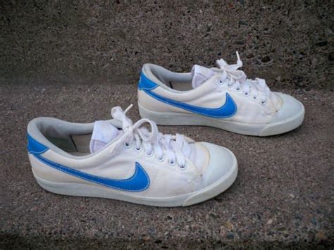 nike shoes with blue swoosh.